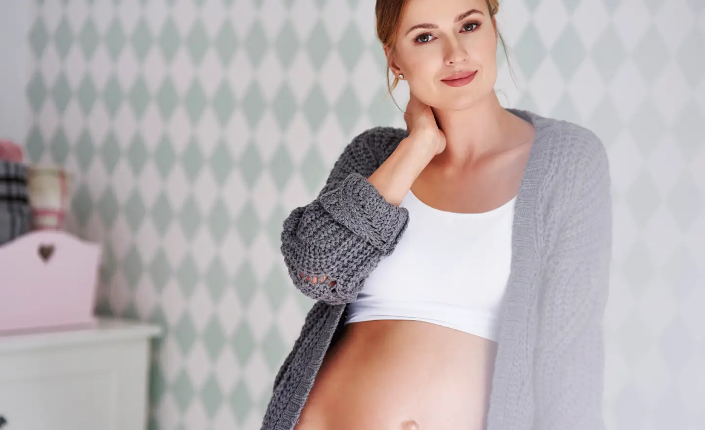 Woman considering mommy makeover plastic surgery to restore pre-pregnancy body contour
